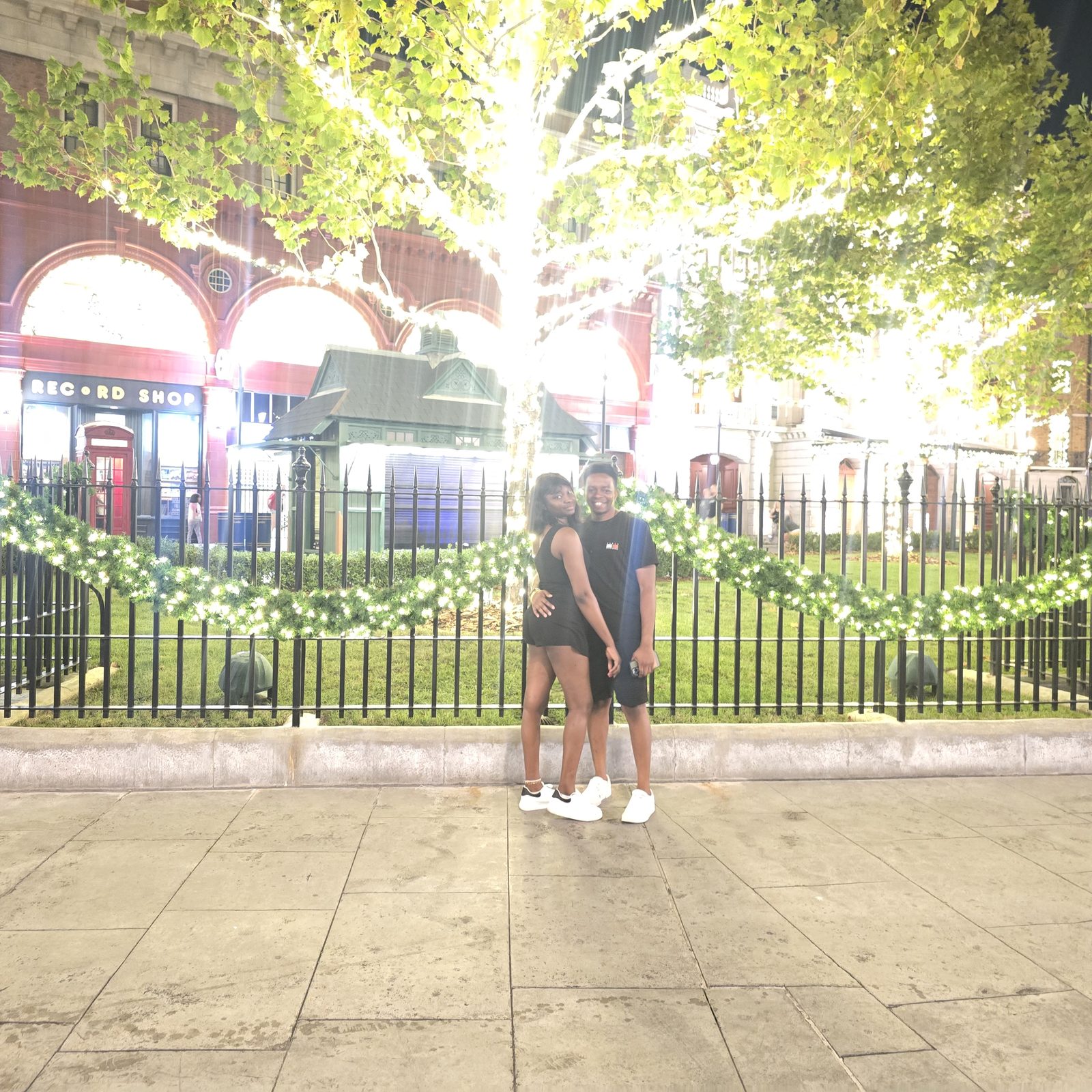 Paschal and Maryanne under the lights at night